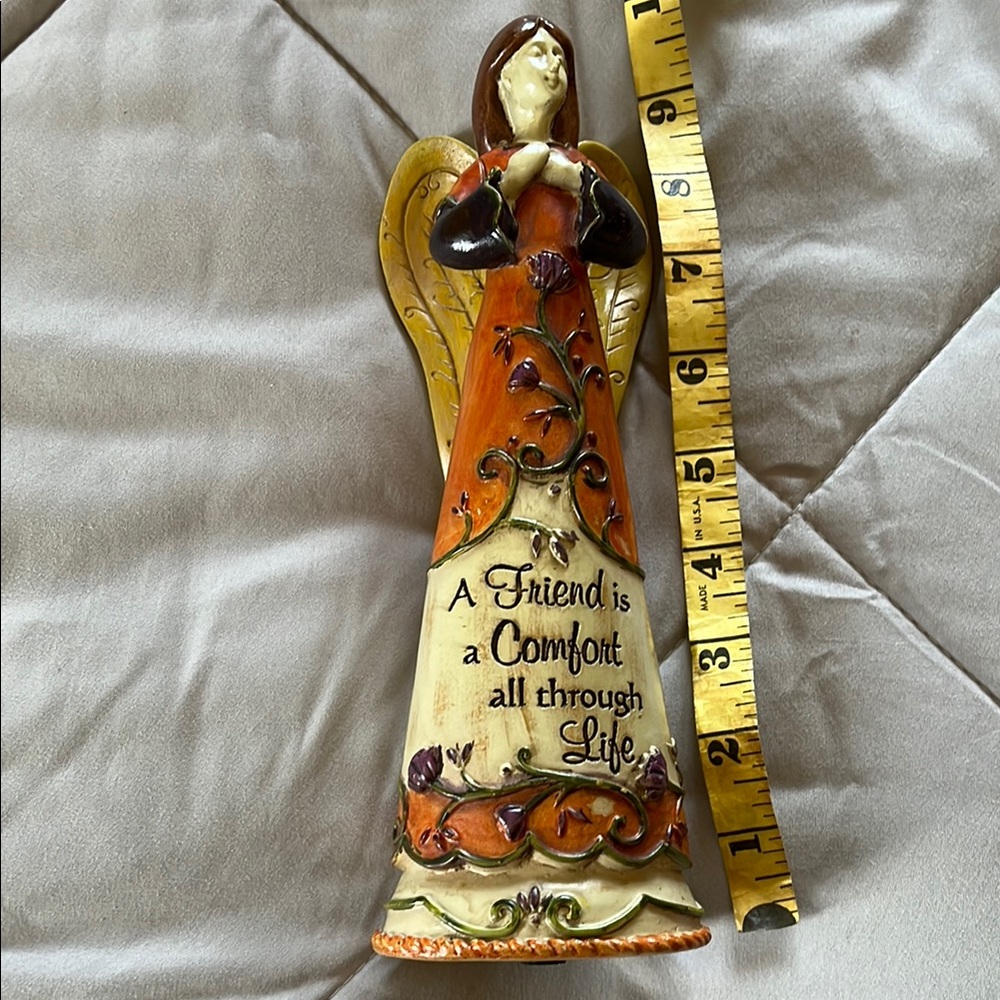 Decorative Angel Figurine with Orange and Brown Accents